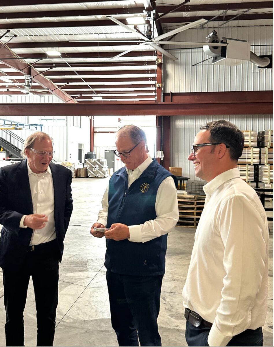 Mike Braun talking with Hammond Machine Works employees